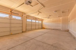 The inside of a newly built two car garage