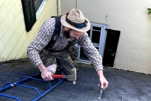 an employee repairing a roof
