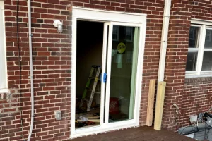 A newly built screen porch from the outside of a house